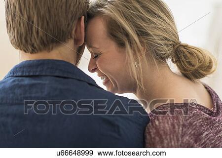 Stock Photo - Close-up of smiling woman leaning on man. Fotosearch