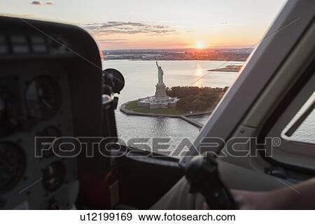 Cockpit in helicopter and Statue of Liberty View Large Photo Image Stock Photo - Cockpit in helicopter and Statue of Liberty . Fotosearch