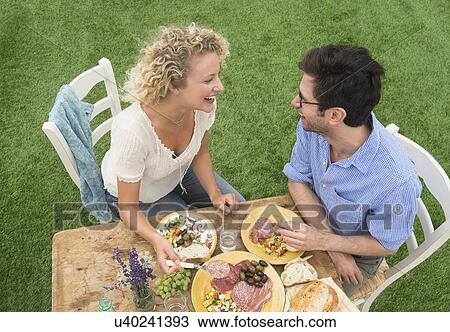 Couple having rustic breakfast View Large Photo Image Stock Image - Couple having rustic breakfast. Fotosearch