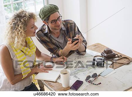 Couple making plans for travel View Large Photo Image Stock Image - Couple making plans for travel. Fotosearch