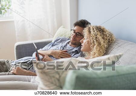 Stock Image - Couple using tablet pc. Fotosearch