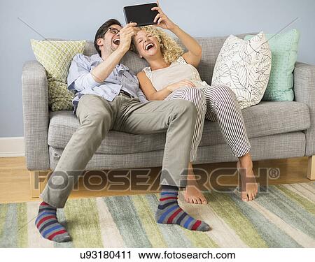 Couple using tablet pc View Large Photo Image Stock Image - Couple using tablet pc. Fotosearch