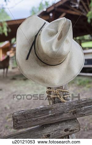 Cowboy hat hanging on wooden fence View Large Photo Image Stock Image - Cowboy hat hanging on wooden fence. Fotosearch