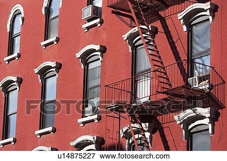 Facade of red building with fire escape View Large Photo Image Stock Photo - Facade of red building with fire escape. Fotosearch