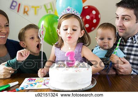 "Family with three children (2-3, 4-5) celebrating birthday" View Large Photo Image Picture - "Family with three children (2-3, 4-5) celebrating birthday". Fotosearch