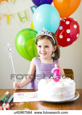 Girl (4-5) at birthday party View Large Photo Image Picture - Girl (4-5) at birthday party. Fotosearch