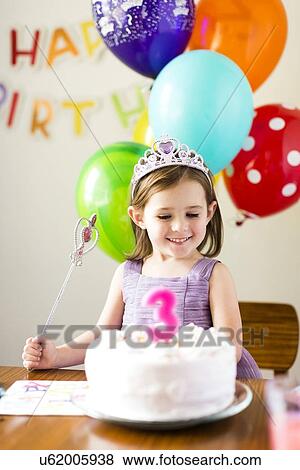 Girl (4-5) at birthday party View Large Photo Image Stock Photo - Girl (4-5) at birthday party. Fotosearch