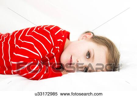 Girl (4-5) hiding in sheets View Large Photo Image Stock Photography - Girl (4-5) hiding in sheets. Fotosearch