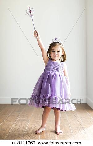 Girl (4-5) in princess costume View Large Photo Image Stock Photo - Girl (4-5) in princess costume. Fotosearch