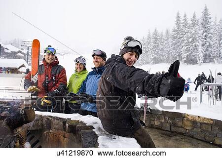 Group of skiers having break View Large Photo Image Stock Image - Group of skiers having break. Fotosearch