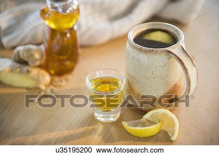 Stock Image - Hot tea with lemon slices. Fotosearch