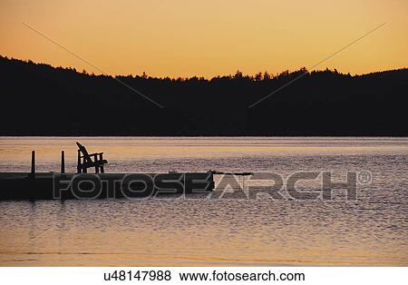 Jetty on lake at dawn View Large Photo Image Stock Photo - Jetty on lake at dawn. Fotosearch