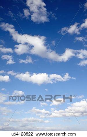 Low angle view of sky and clouds View Large Photo Image Stock Image - Low angle view of sky and clouds. Fotosearch