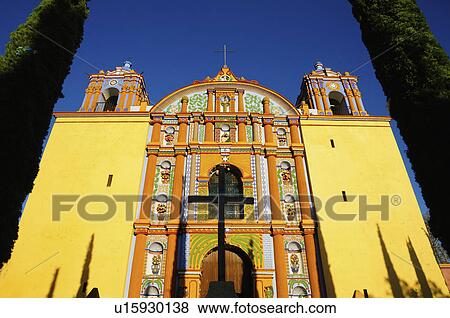 Low angle view of yellow ornate church View Large Photo Image Stock Photo - Low angle view of yellow ornate church. Fotosearch