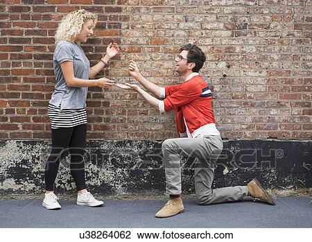 Man proposing to woman View Large Photo Image Stock Image - Man proposing to woman. Fotosearch