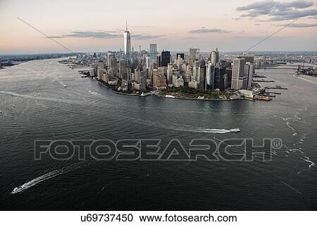 Manhattan skyline at dusk View Large Photo Image Stock Image - Manhattan skyline at dusk. Fotosearch