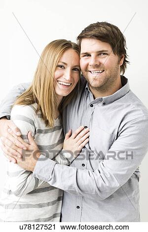 Mid-adult couple embracing View Large Photo Image Stock Image - Mid-adult couple embracing. Fotosearch