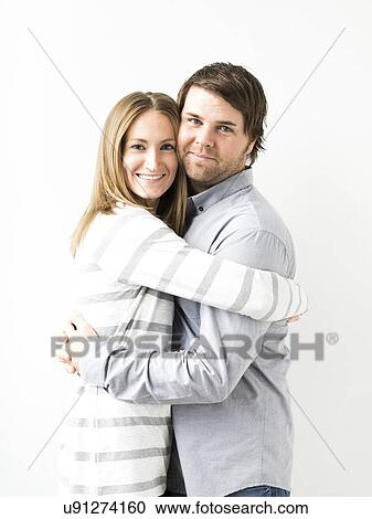 Stock Image - Mid-adult couple embracing. Fotosearch