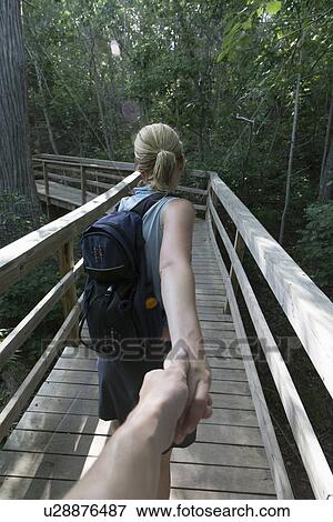 Stock Photo - Mid-adult couple hiking. Fotosearch