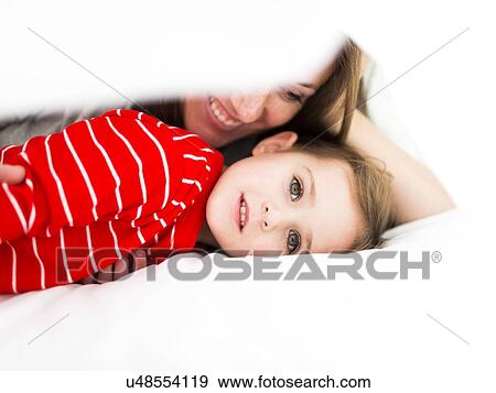 Mom and daughter (2-3) lying in bed View Large Photo Image Stock Photo - Mom and daughter (2-3) lying in bed. Fotosearch