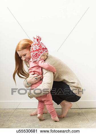 Mother embracing baby son (2-3) View Large Photo Image Stock Image - Mother embracing baby son (2-3). Fotosearch