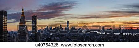 Panoramic view of city at dusk View Large Photo Image Stock Photograph - Panoramic view of city at dusk. Fotosearch