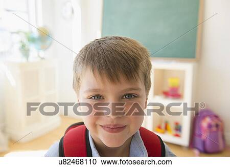 Portrait of boy (6-7) in classroom View Large Photo Image Stock Image - Portrait of boy (6-7) in classroom. Fotosearch