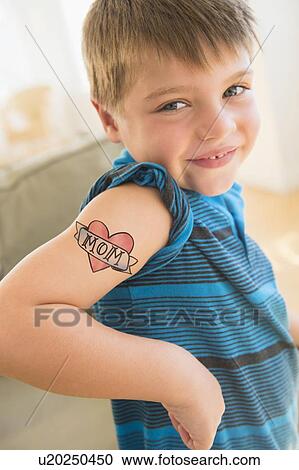 Portrait of boy (6-7) with tatoo on shoulder View Large Photo Image Stock Image - Portrait of boy (6-7) with tatoo on shoulder. Fotosearch
