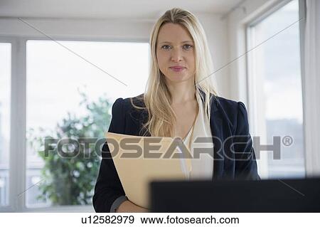 Stock Photo - Portrait of businesswoman in office. Fotosearch