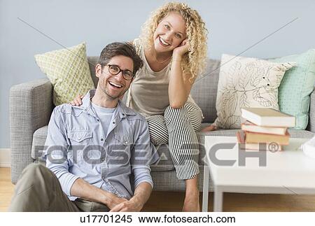 Portrait of couple in living room View Large Photo Image Stock Photography - Portrait of couple in living room. Fotosearch