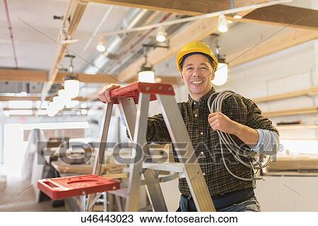 Portrait of electrician in hardhat View Large Photo Image Stock Image - Portrait of electrician in hardhat. Fotosearch
