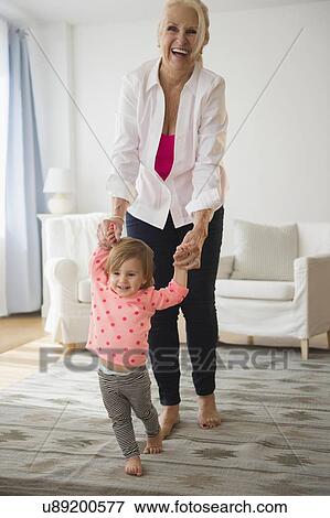Portrait of grandmother playing with granddaughter ( 2-3 ) View Large Photo Image Stock Photo - Portrait of grandmother playing with granddaughter ( 2-3 ). Fotosearch