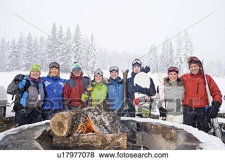 Portrait of group of friends with bonfire in winter View Large Photo Image Stock Photo - Portrait of group of friends with bonfire in winter. Fotosearch