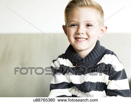Stock Image - Portrait of smiling boy (6-7). Fotosearch