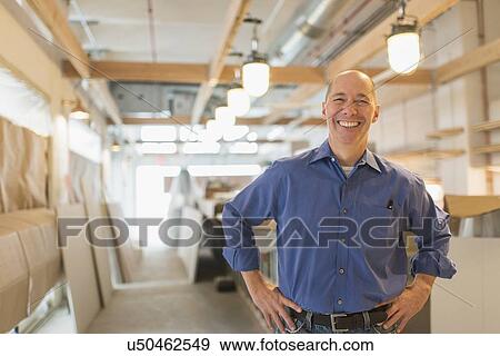 Stock Photo - Portrait of smiling business owner. Fotosearch