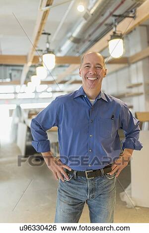 Stock Photograph - Portrait of smiling business owner. Fotosearch