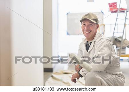 Stock Image - Portrait of smiling manual worker. Fotosearch