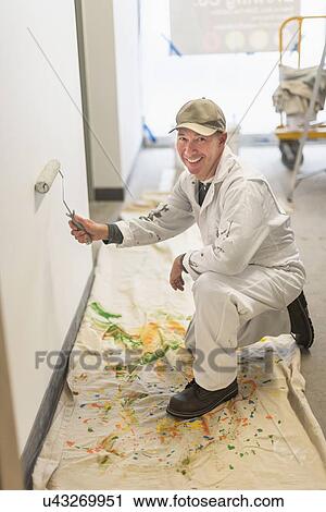 Portrait of smiling manual worker painting wall View Large Photo Image Stock Image - Portrait of smiling manual worker painting wall. Fotosearch