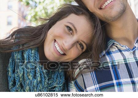 Stock Photography - Portrait of young couple outdoors. Fotosearch