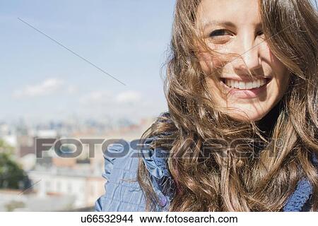 Portrait of young woman on roof View Large Photo Image Picture - Portrait of young woman on roof. Fotosearch