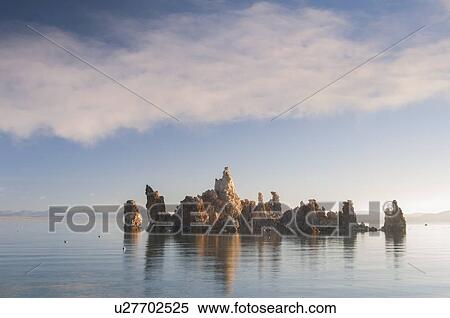 Stock Photography - Rock formation in lake. Fotosearch
