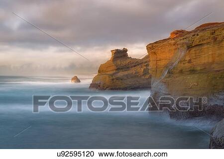 Scenic view of cliffs along coastline View Large Photo Image Stock Image - Scenic view of cliffs along coastline. Fotosearch