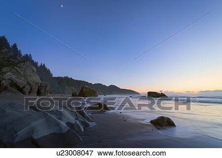 Scenic view of coastline at sunset View Large Photo Image Stock Photo - Scenic view of coastline at sunset. Fotosearch