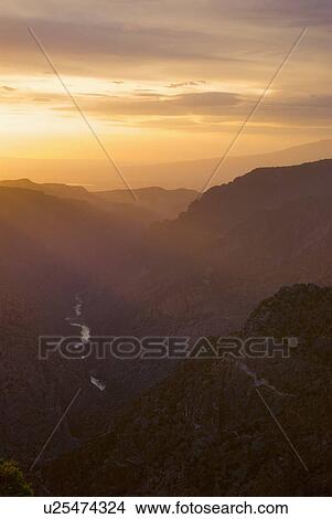 Scenic view of landscape at sunset View Large Photo Image Picture - Scenic view of landscape at sunset. Fotosearch