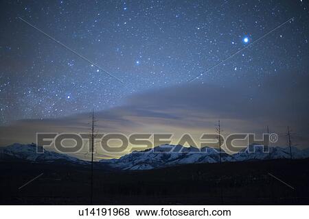 Stock Photo - Scenic view of night sky with aurora borealis. Fotosearch