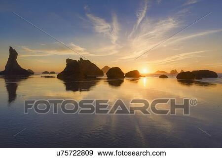 Stock Photo - Scenic view of seascape at sunset. Fotosearch