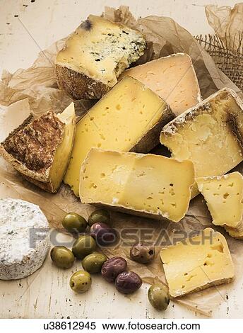 "Selection of cheese on wooden table, studio shot" View Large Photo Image Stock Photography - "Selection of cheese on wooden table, studio shot". Fotosearch