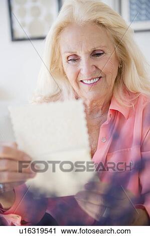 Senior woman reading letter View Large Photo Image Stock Image - Senior woman reading letter. Fotosearch