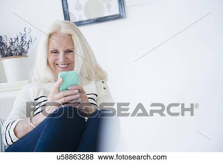 Stock Photo - Senior woman texting. Fotosearch