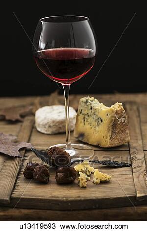 "Still life with cheese and red wine on wooden table, studio shot" View Large Photo Image Stock Image - "Still life with cheese and red wine on wooden table, studio shot". Fotosearch